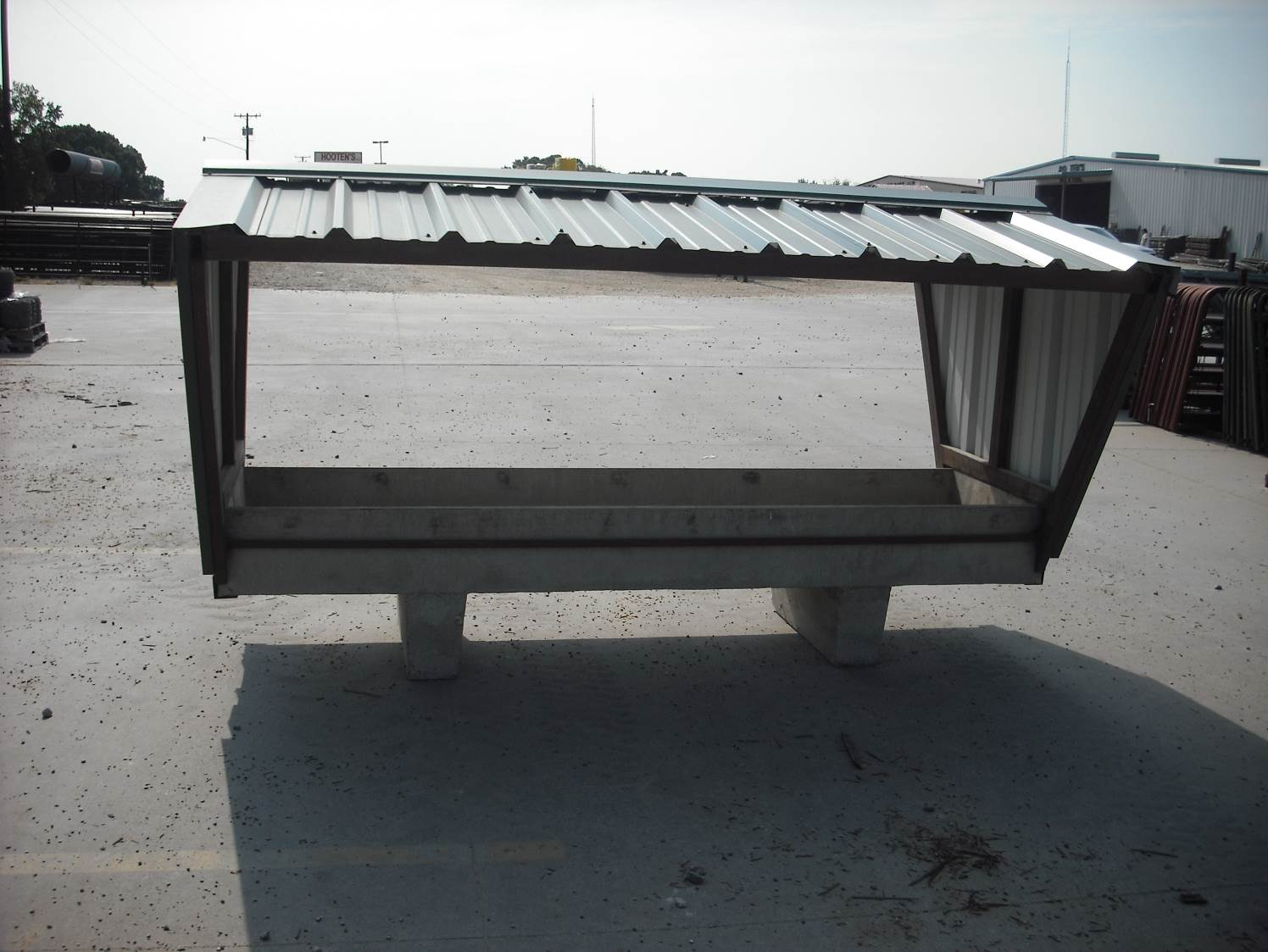 CONCRETE FEED TROUGH W/ METAL TOP